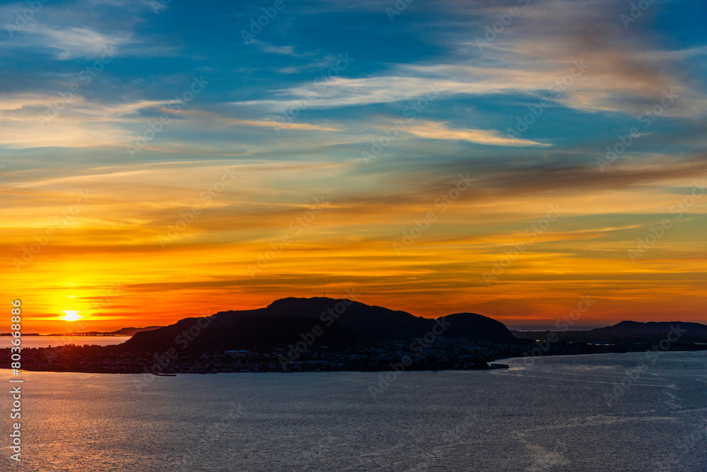  top view of a sunset over The city of Alesund and the sea during a sunny evening, Norway