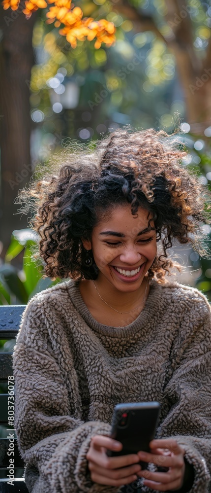 A woman with curly hair is sitting on a bench A woman with curly hair is sitting on a bench