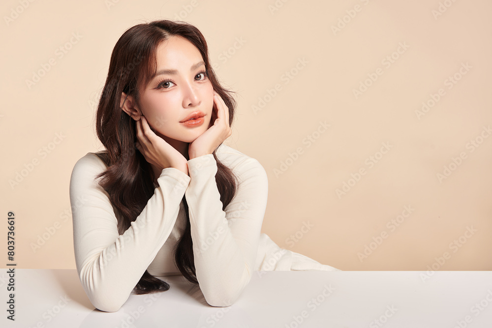 Beautiful young asian woman with clean fresh skin on beige background, Face care, Facial treatment, Cosmetology, beauty and spa, Asian women portrait. Beautiful young asian woman with clean fresh skin on beige background, Face care, Facial treatment, Cosmetology, beauty and spa, Asian women portrait.