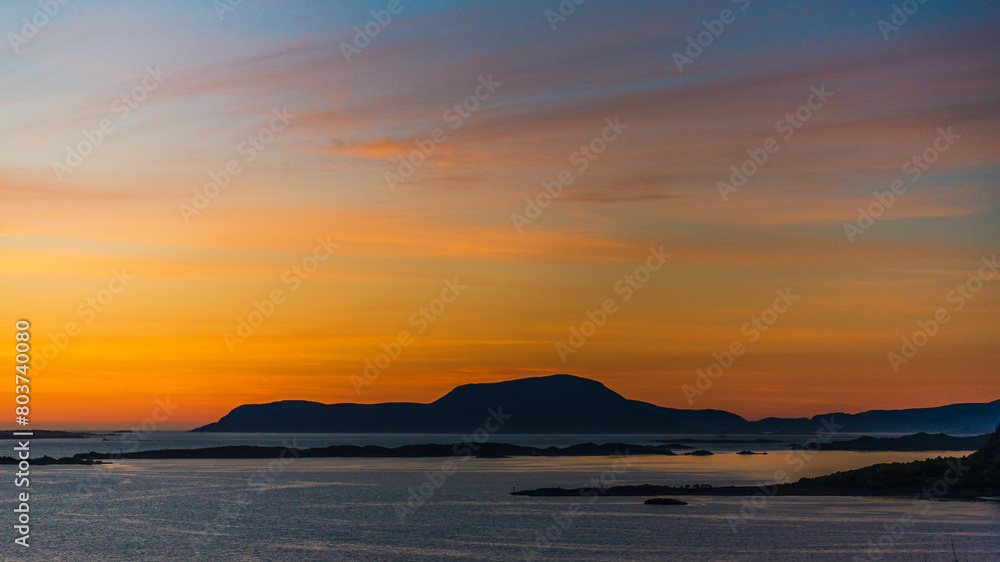 Naklejka premium top view of a sunset over Alesund during a sunny spring evening, Norway
