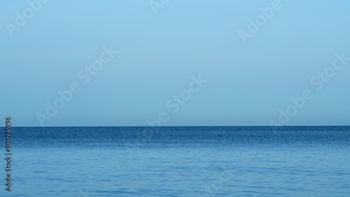 Blue Sky And Small Smooth Waves. Dramatic Landscape Clouds Above The Sea Or Ocean. Real time. © artifex.orlova