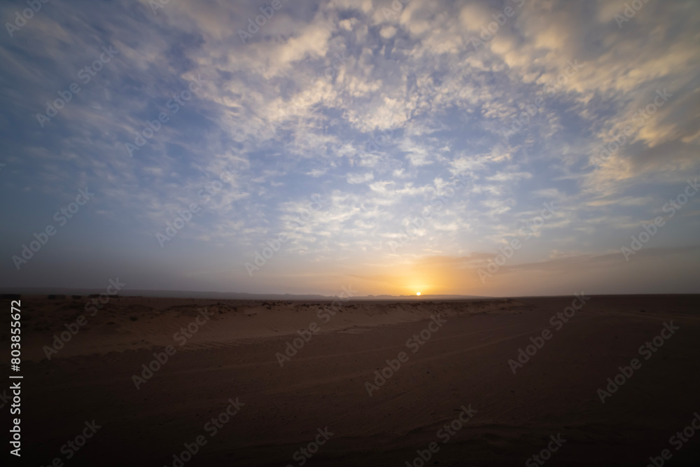A sunrise of desert at Mhamid el Ghizlane in Morocco wide shot A sunrise of desert at Mhamid el Ghizlane in Morocco wide shot