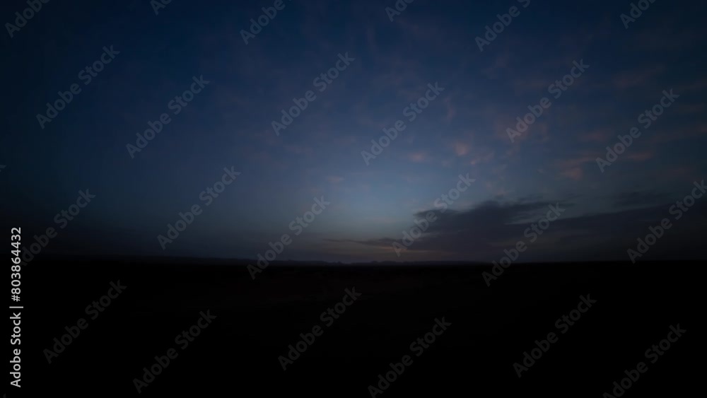 A sunrise timelapse of desert at Mhamid el Ghizlane in Morocco wide shot A sunrise timelapse of desert at Mhamid el Ghizlane in Morocco wide shot