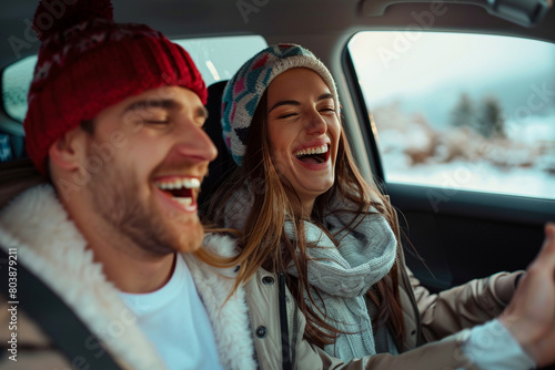 Young couple shares lighthearted moments and laughing in the car