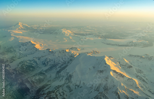 Aerial view of snow mountain in morning sunlight in Alaska © nd700