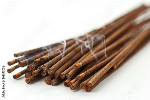 Brown Indian incense sticks on a white background for meditation photo