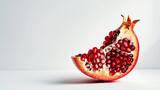 Piece of Pomegranate  isolated on a white background. Red sweet fruit