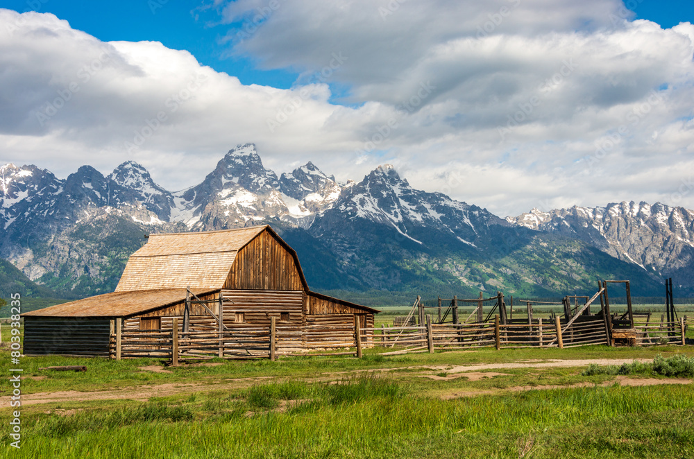 The John Moulton Barn and the Teton Range at Grand Teton National Park in Northwestern Wyoming The John Moulton Barn and the Teton Range at Grand Teton National Park in Northwestern Wyoming