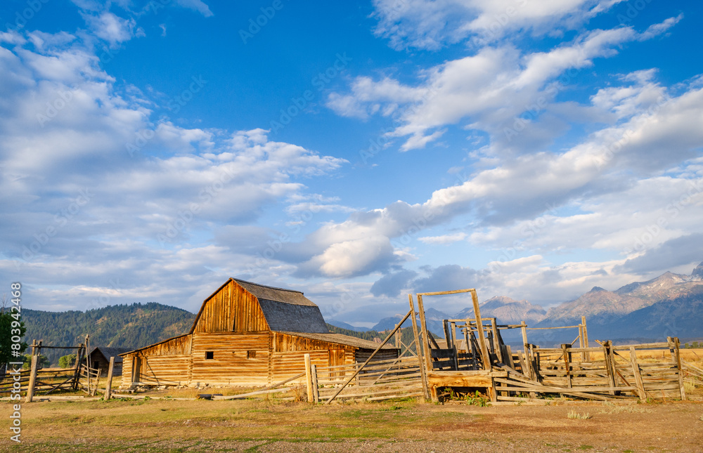 The John Moulton Barn and the Teton Range at Grand Teton National Park in Northwestern Wyoming The John Moulton Barn and the Teton Range at Grand Teton National Park in Northwestern Wyoming