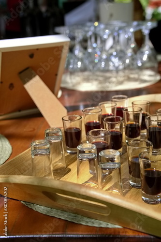 Alcohol drink in glasses on rustic table