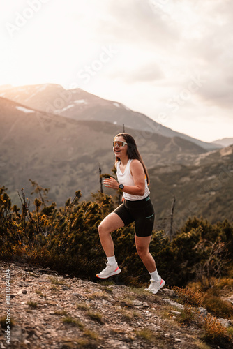 Young traveler Runner girl with backpacks. Hiking in mountains. Tourist traveler. Hiking in Slovakia mountains landscape. Low Tatras national park, Slovakia. © alexanderuhrin