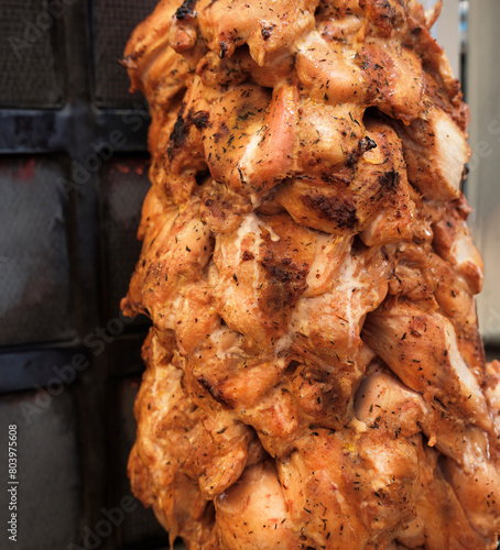 Kebab Rolling of Meat Chicken Preparation Placed on spit grilled with a burn.