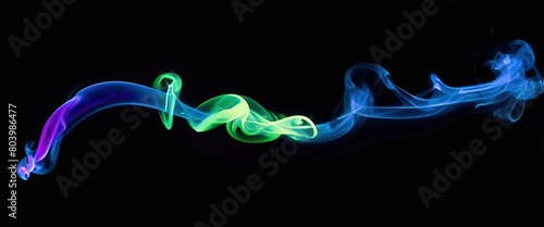 Flowing colorful smoke stream on black background