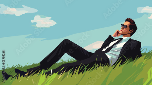 Young man in formal clothes relaxing on green grass 