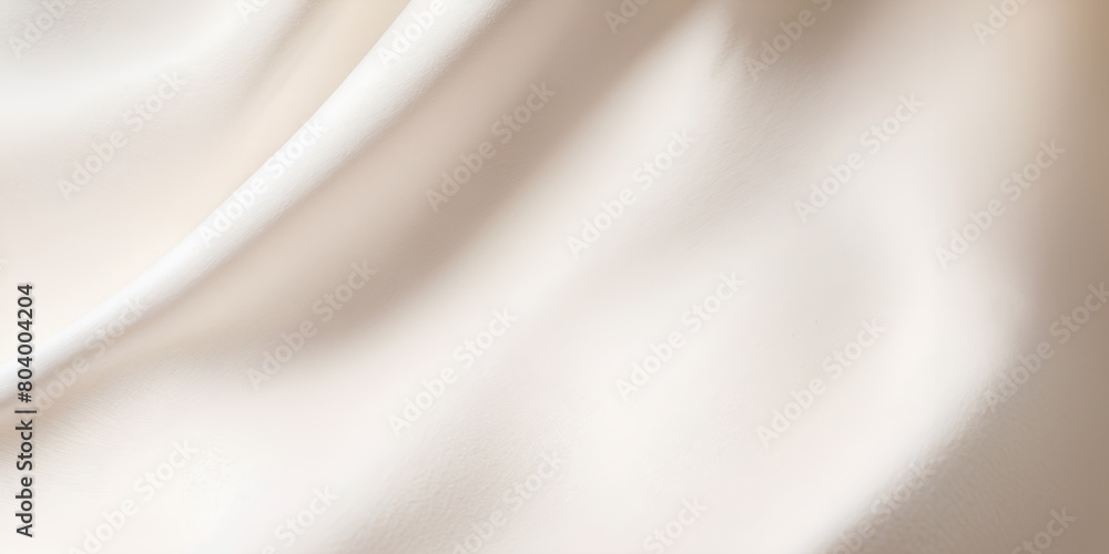 Fototapeta premium A white fabric with a pattern of waves. The fabric is smooth and silky. The waves are gentle and flowing, giving the fabric a sense of calmness and serenity