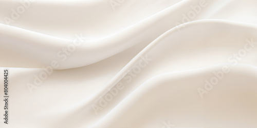 A white fabric with a pattern of waves. The fabric is smooth and silky. The waves are gentle and flowing  giving the fabric a sense of calmness and serenity