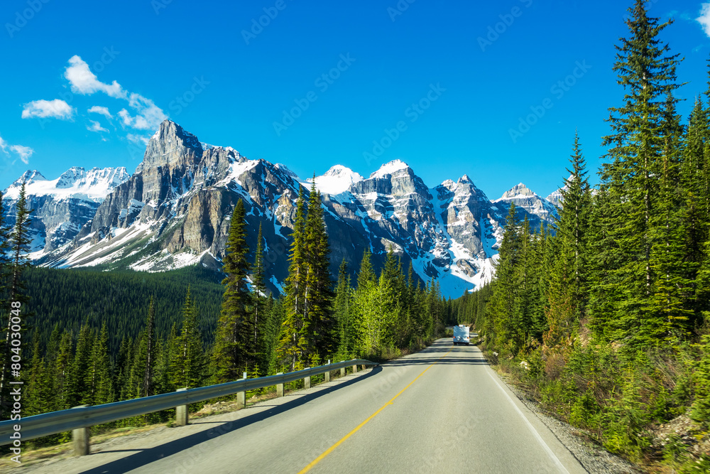 Driving  to Moraine Lake with the view of ten peaks against the blue sky, Banff National Park, Canada