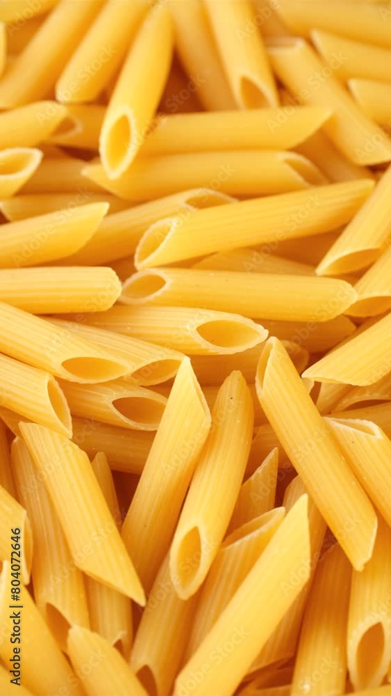 Uncooked italian pasta penne, rotation Uncooked italian pasta penne, rotation