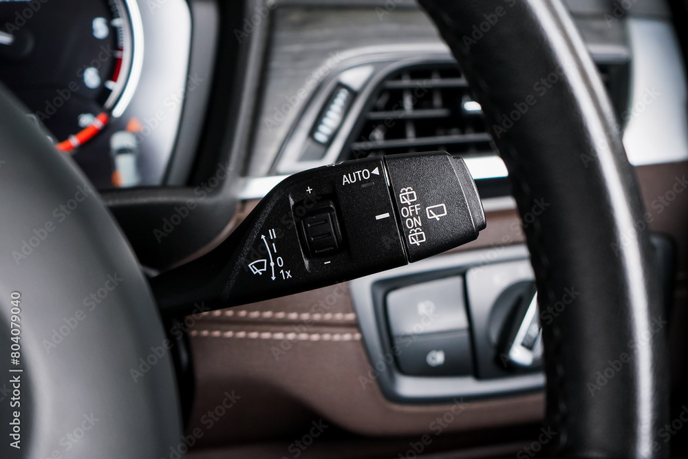 Switch off lights in a car. close-up Car integrated turning indicator with headlight switch toggle.