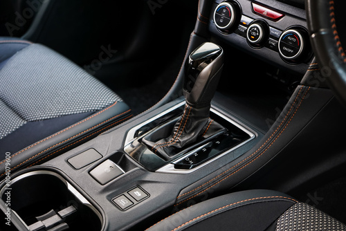 automatic transmission shift selector in the car interior. Closeup a manual shift of modern car gear shifter. 4x4 gear shift	