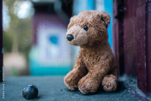 Abandoned Innocence: Lonely Stuffed Bear Toy Left in a Park, Evoking Poignant Symbolism of Childhood Loss or kidnapping