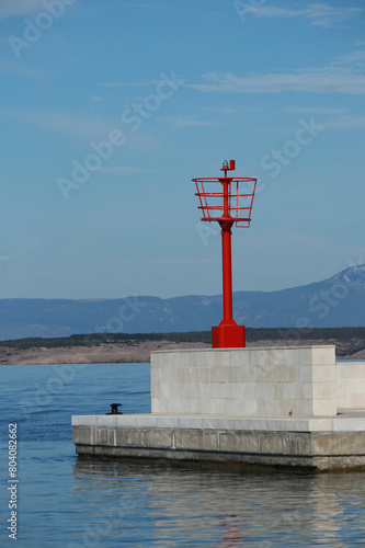 jetty with a red lighthouse, Crikvenica, Croatia photo