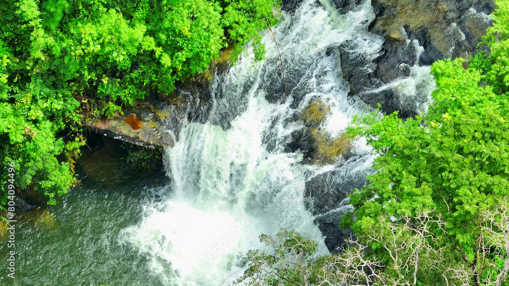 Majestic Waters: A stunning waterfall in the heart of a tropical paradise. Nature's grandeur on full display with lush green forests. Pra on la or Waterfall, Thailand. Aerial view.
Majestic Waters: A stunning waterfall in the heart of a tropical paradise. Nature's grandeur on full display with lush green forests. Pra on la or Waterfall, Thailand. Aerial view.