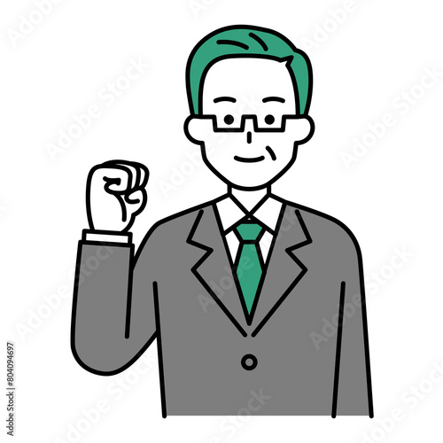 ガッツポーズをする年配のスーツの男性