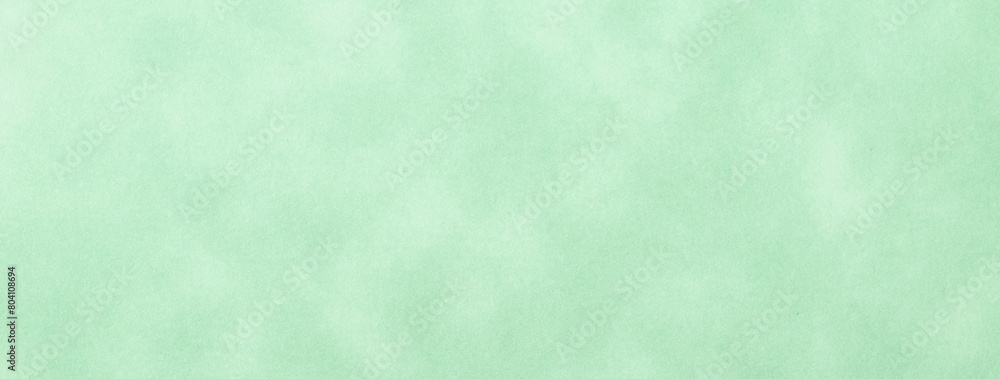 Texture of light green old paper, crumpled background. Vintage olive grunge surface backdrop.