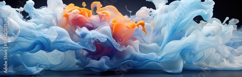 Explosions of tangerine and blue liquid paint in water.