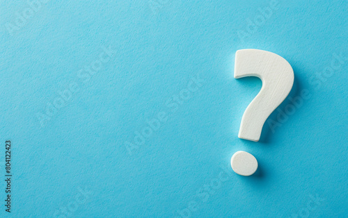 White question mark on blue background with copy space. Issue solving concept