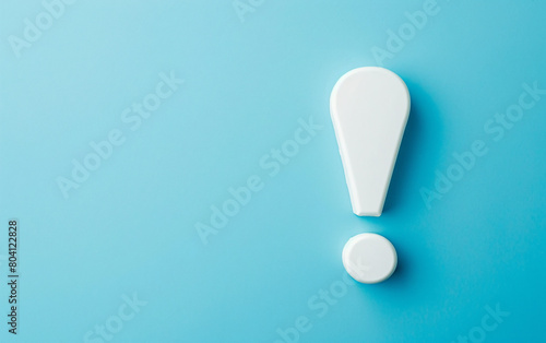 White exclamation mark on blue background with copy space.