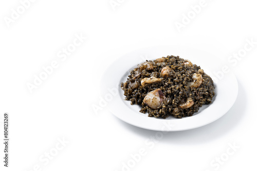 Black rice with seafood isolated on white background. Copy space