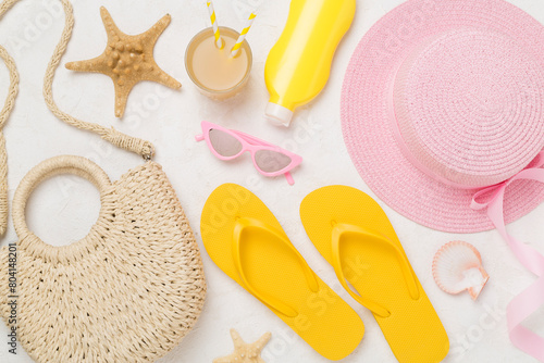 Flat lay with colorful beach accessories on concrete background. Vacation concept