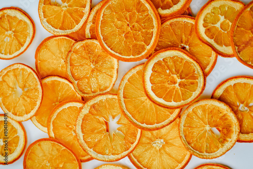 Brightly dried orange slices packed tightly together, showcasing vibrant textures and citrus aromas