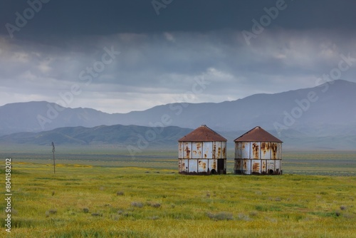 Abandoned rusted grain silos in the countryside in Carrizo National Monument, Santa Margarita, California, United States of America.