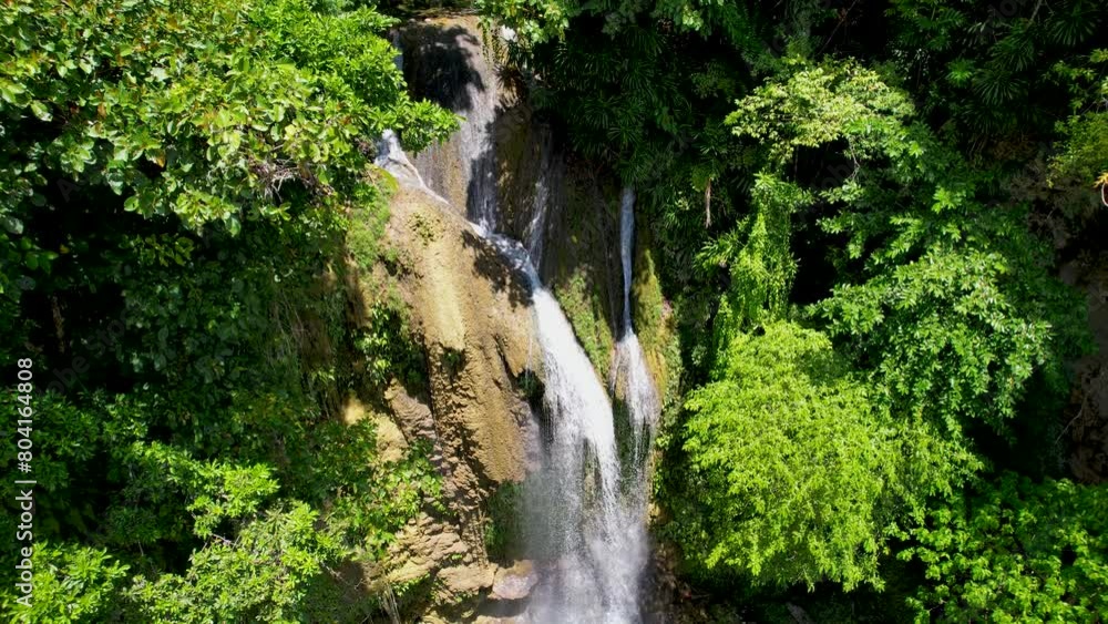 4K Aerial Drone video of wonderful cascading Twin Falls with emerald water in lush green jungle on a sunny day in Bohol, Philippines. Pahangog waterfalls 4K Aerial Drone video of wonderful cascading Twin Falls with emerald water in lush green jungle on a sunny day in Bohol, Philippines. Pahangog waterfalls