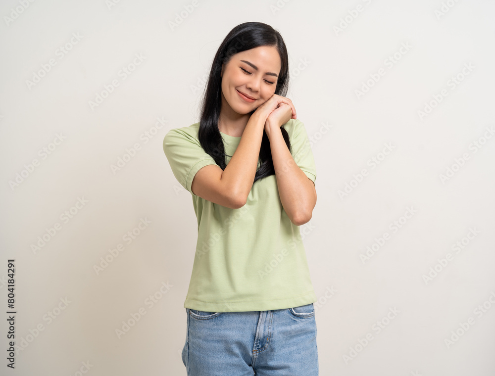 Beautiful smiling happy young asian woman age around 25 in green shirt. Charming female lady standing pose on isolated white background. Asian woman people confident with backdrop. Beautiful smiling happy young asian woman age around 25 in green shirt. Charming female lady standing pose on isolated white background. Asian woman people confident with backdrop.