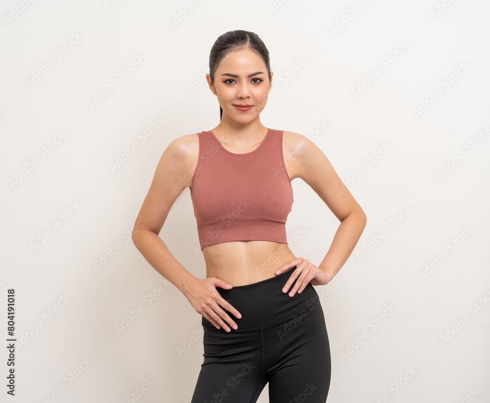 Young beautiful smiling asian woman with sportswear on isolated white background. Portrait happy healthy slim fit and firm latin attractive sporty woman standing pose exercise workout in studio. Young beautiful smiling asian woman with sportswear on isolated white background. Portrait happy healthy slim fit and firm latin attractive sporty woman standing pose exercise workout in studio.