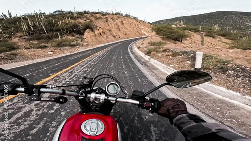 Motorcyclist driving on highway route. photo