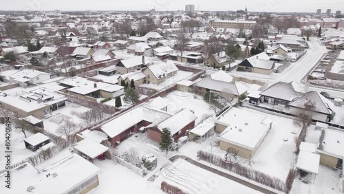 Real Estate Subdivision on Winter Weather Covered By Snow - Aerial Shot photo