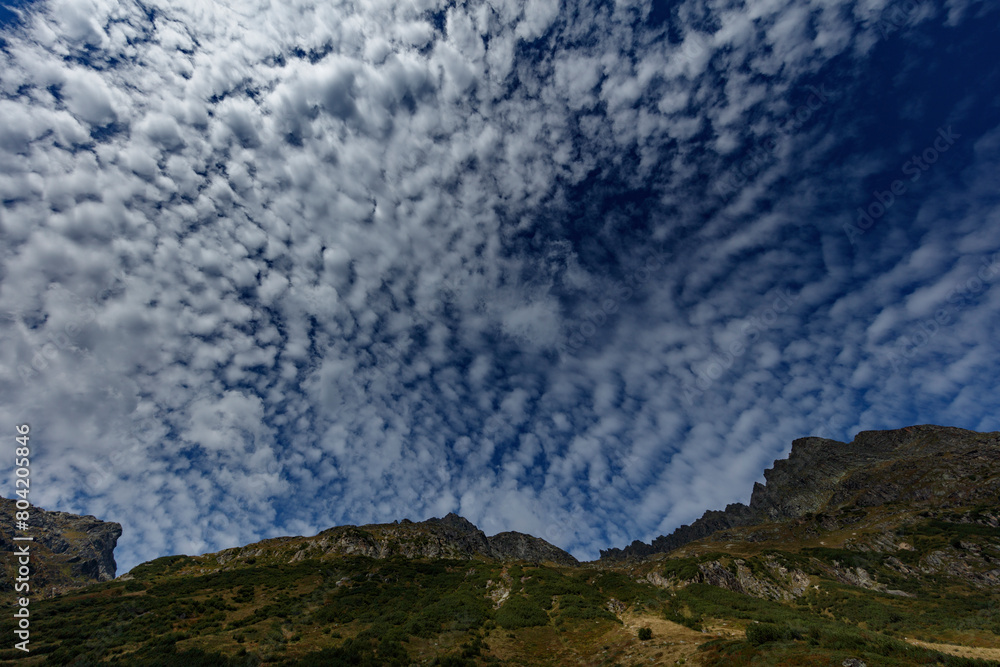 Fluffy Clouds Above Vorarlberg's Mountains