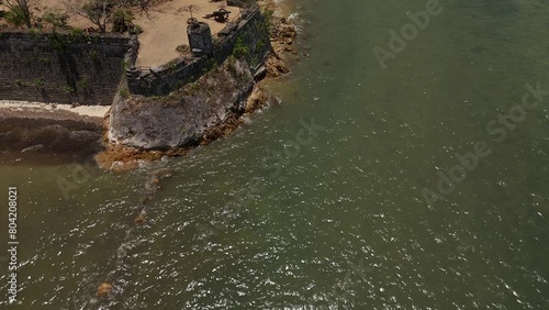 Flying across the front of Fort Isabel, descending and tilting up to show Taytay port near the fort. photo