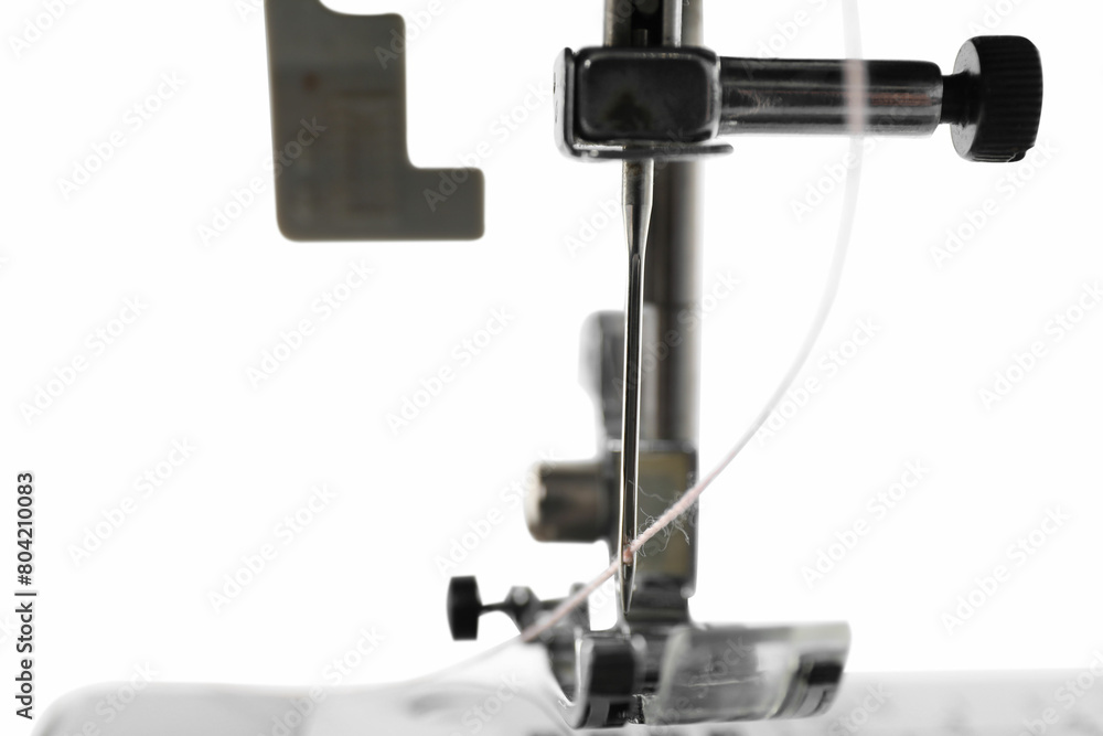One modern sewing machine isolated on white One modern sewing machine isolated on white