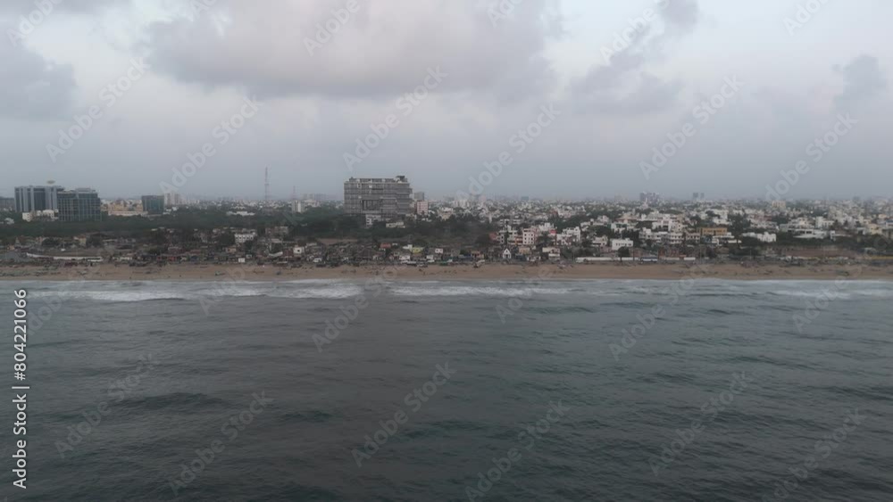 A cinematic drone shot capturing beautiful view of beach in Chennai city A cinematic drone shot capturing beautiful view of beach in Chennai city
