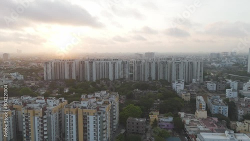 A dynamic drone footage of Chennai's skyline, capturing the city's vibrant energy amidst a cloudy ambiance. photo