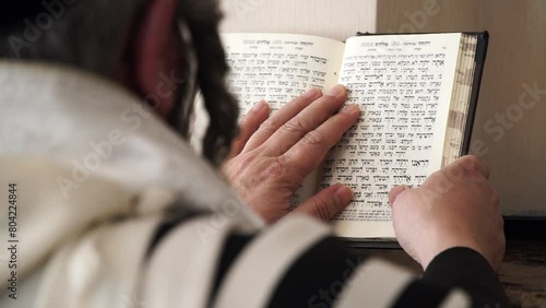 Hand of young boy reading the Jewish Torah at Bar Mitzvah Bar Mitzvah Torah