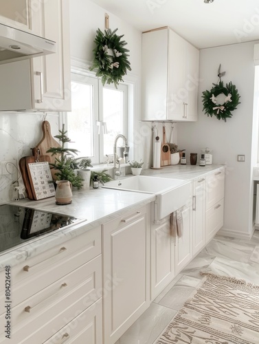 Festively decorated kitchen with Christmas wreaths and natural greenery.