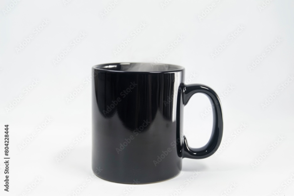 A black coffee mug with steam rising from it A black coffee mug with steam rising from it