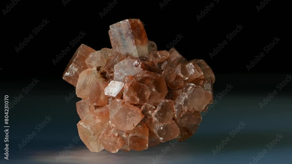 Aragonite 'Sputnik' (calcium carbonate) rotating slowly against a black background Aragonite 'Sputnik' (calcium carbonate) rotating slowly against a black background